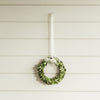 Boxwood Wreath with a White Ribbon